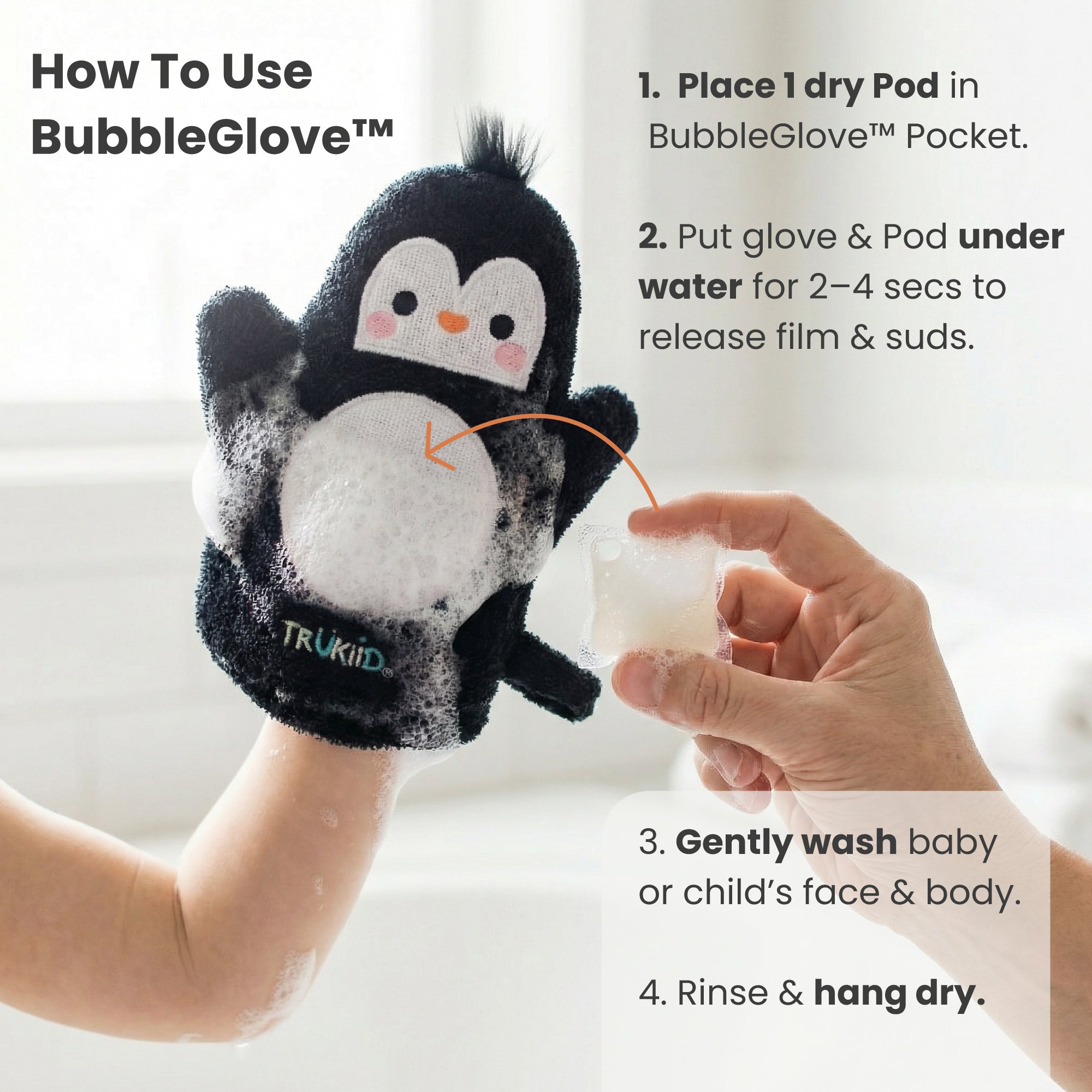 Penguin-themed BubbleGlove with instructions on how to use it, held by a hand.