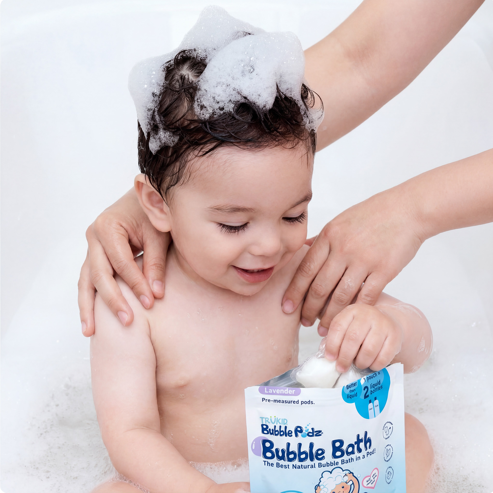 Child being bathed with a pouch of  Bubble Bath Podz in the foreground