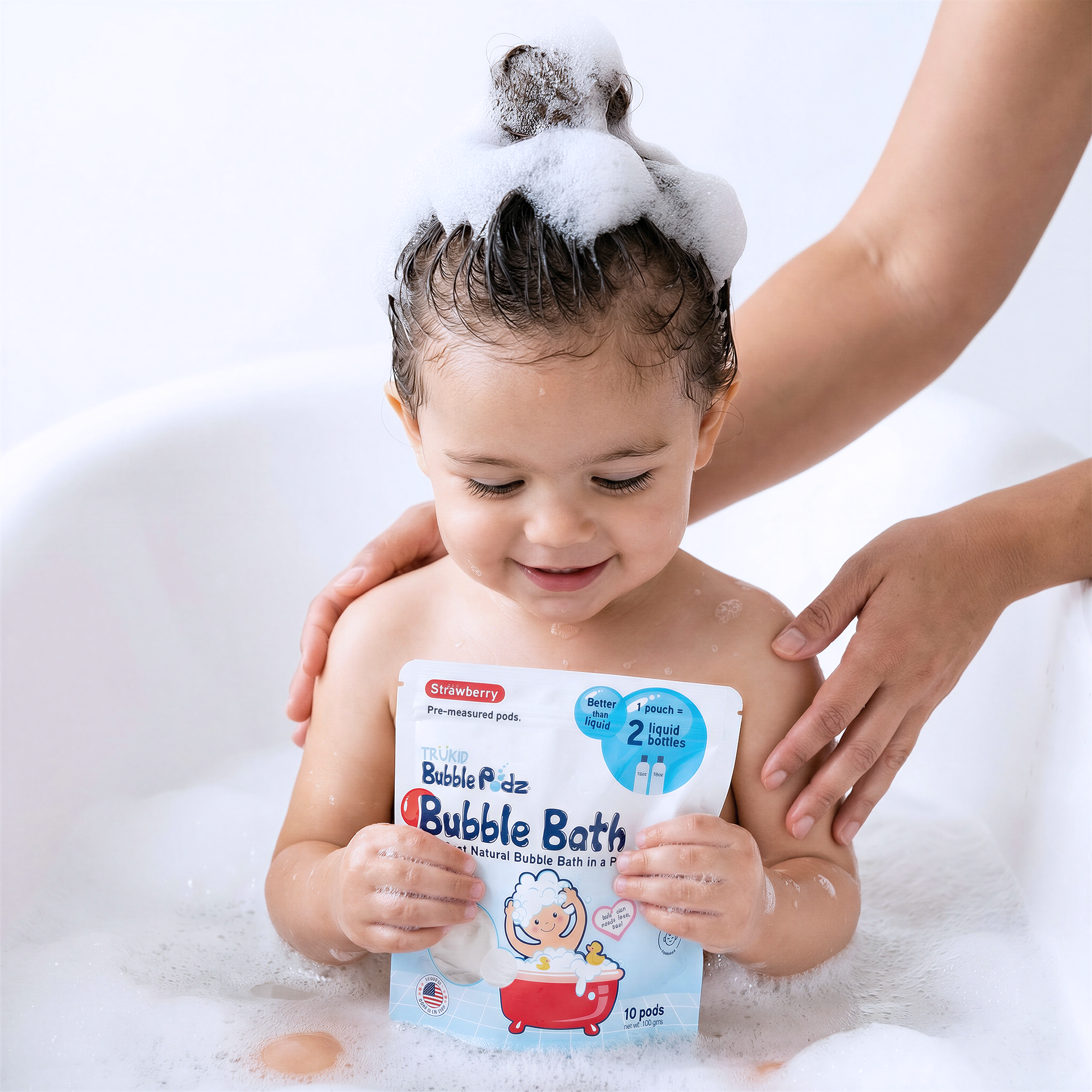 Child in a bathtub with bubble bath packaging, surrounded by bubbles
